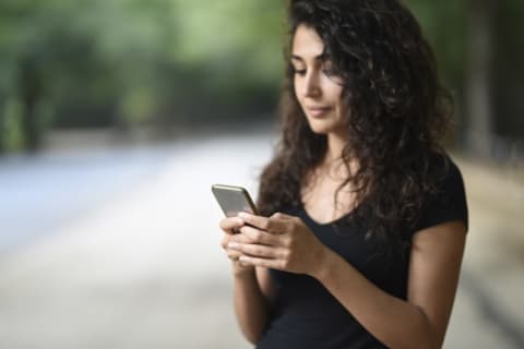 woman checking phone