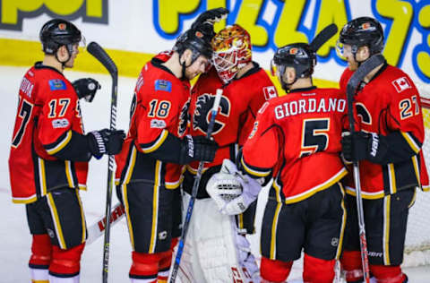 Mar 5, 2017; Calgary, Alberta, CAN; Calgary Flames goalie Brian Elliott (1) celebrate win with teammates against the New York Islanders at Scotiabank Saddledome. Calgary Flames won 5-2. Mandatory Credit: Sergei Belski-USA TODAY Sports