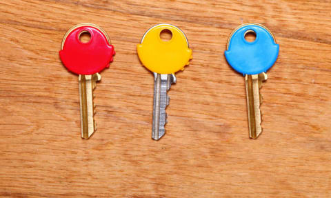 keys with colorful plastic caps on table