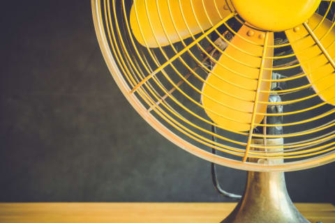 Close-up of a yellow fan.