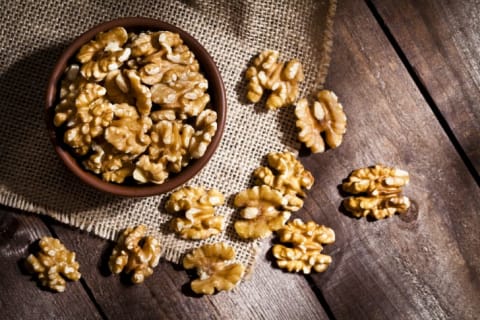 bowl of walnuts on wood table