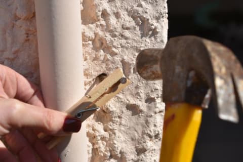 clothespin holding nail