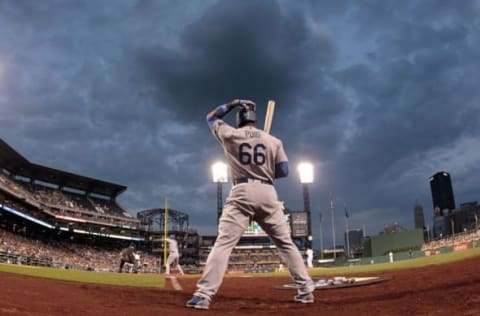 Jun 24, 2016; Pittsburgh, PA, USA; Los Angeles Dodgers right fielder Yasiel Puiig (66) waits to bat in the on-deck circle against the Pittsburgh Pirates during the sixth inning at PNC Park. Mandatory Credit: Charles LeClaire-USA TODAY Sports