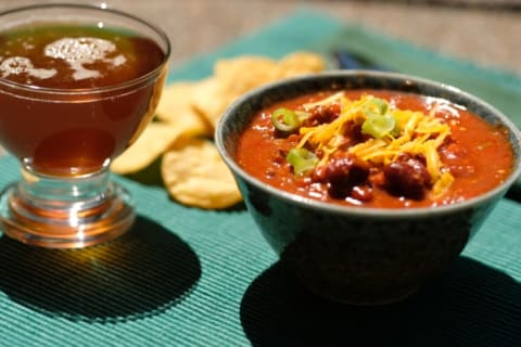 Bowl of chili with beer.