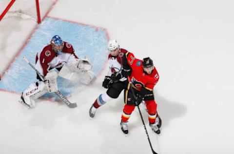 CALGARY, AB – JANUARY 9: Mark Jankowski #77 of the Calgary Flames battles against Ryan Graves #27 of the Colorado Avalanche at Scotiabank Saddledome on January 9, 2019 in Calgary, Alberta, Canada. (Photo by Gerry Thomas/NHLI via Getty Images)