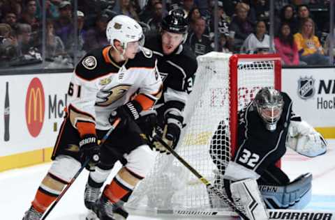 LOS ANGELES, CA – SEPTEMBER 29: Troy Terry #61 of the Anaheim Ducks skates with the puck with pressure from Dion Phaneuf #3 of the Los Angeles Kings as goaltender Jonathan Quick #32 tends net during the second period of the preseason game at Staples Center on September 29, 2018, in Los Angeles, California. (Photo by Juan Ocampo/NHLI via Getty Images)