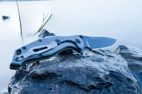 Tactical knife on a rock