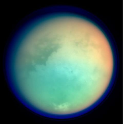 This undated NASA handout shows Saturn's moon, Titan, in ultraviolet and infrared wavelengths. The Cassini spacecraft took the image while on its mission to gather information on Saturn, its rings, atmosphere and moons. The different colors represent various atmospheric content on Titan.