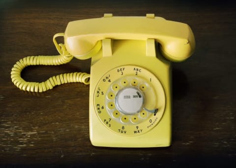 Yellow rotary phone.