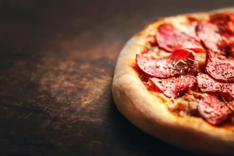 Pizza on wooden table