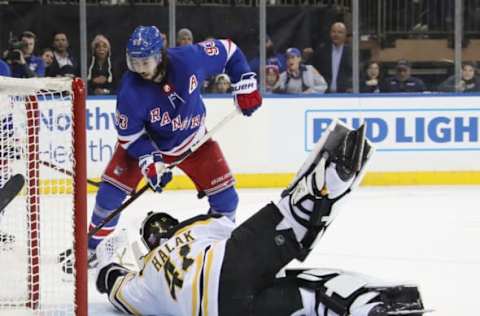 NEW YORK, NEW YORK – FEBRUARY 06: Jaroslav Halak #41 of the Boston Bruins makes the save on Mika Zibanejad #93 of the New York Rangers during overtime at Madison Square Garden on February 06, 2019 in New York City. The Rangers defeated the Bruins 4-3 in the shoot-out. (Photo by Bruce Bennett/Getty Images)