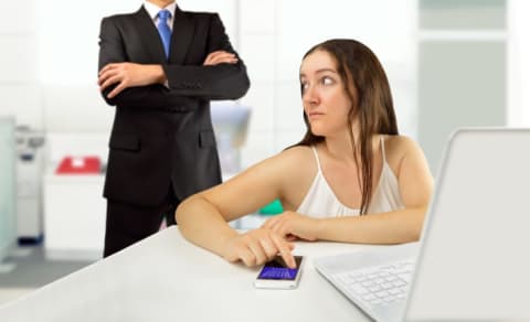 A woman gets caught cyberloafing at work