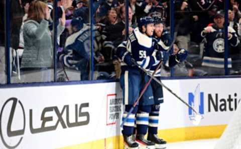 COLUMBUS, OHIO – OCTOBER 18: Vladislav Gavrikov #4 of the Columbus Blue Jackets celebrates his game winning goal with Yegor Chinakhov #59 during overtime against the Vancouver Canucks at Nationwide Arena on October 18, 2022 in Columbus, Ohio. The Columbus Blue Jackets won 4-3. (Photo by Emilee Chinn/Getty Images)