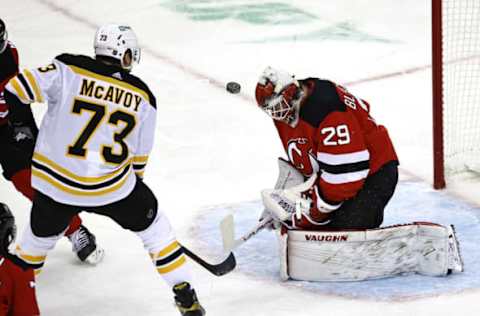 NEWARK, NEW JERSEY – JANUARY 14: Mackenzie Blackwood #29 of the New Jersey Devils stops a shot by Charlie McAvoy #73 of the Boston Bruins in the first period during the home opening game at Prudential Center on January 14, 2021 in Newark, New Jersey. (Photo by Elsa/Getty Images)