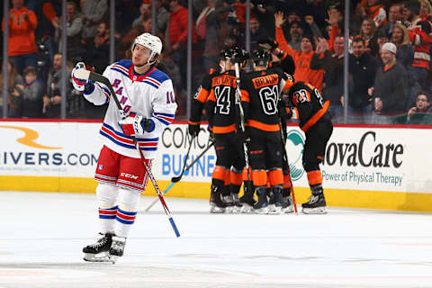 PHILADELPHIA, PA – FEBRUARY 28: Artemi Panarin #10 of the New York Rangers reacts as Sean Couturier #14, Nicolas Aube-Kubel #62, and Claude Giroux #28 of the Philadelphia Flyers celebrate a goal by Claude Giroux in the second period at the Wells Fargo Center on February 28, 2020 in Philadelphia, Pennsylvania. (Photo by Mitchell Leff/Getty Images)