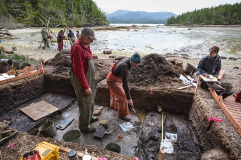 Researchers Daryl Fedje (left) and Duncan McLaren (right) dig at the Calvert Island site.