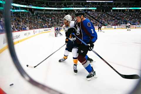 Mar 5, 2016; Denver, CO, USA; Nashville Predators center Mike Ribeiro (63) and Colorado Avalanche defenseman Nick Holden (2) battle for the puck in the first period at the Pepsi Center. Mandatory Credit: Isaiah J. Downing-USA TODAY Sports