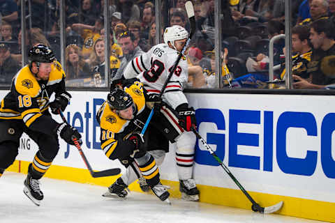 BOSTON – SEPTEMBER 28: Boston Bruins left wing Anders Bjork (10) and Chicago Blackhawks defenseman Chad Krys (43) collide during the second period. The Boston Bruins host the Chicago Blackhawks in their final pre-season NHL hockey game at TD Garden in Boston on Sep. 28, 2019. (Photo by Nic Antaya for The Boston Globe via Getty Images)