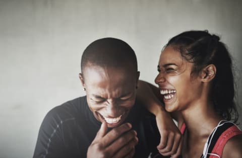 man and woman laughing