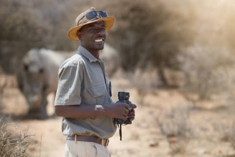 man with binoculars in the wild