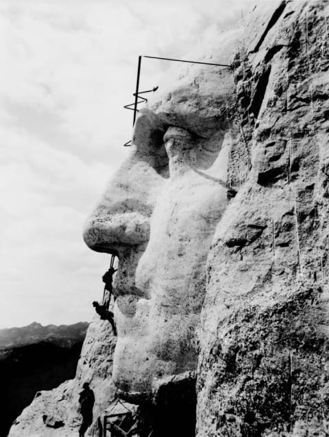 Workers construct George Washington's image on Mount Rushmore