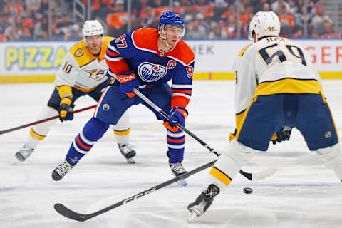 Nov 4, 2023; Edmonton, Alberta, CAN; Edmonton Oilers forward Connor McDavid (97) carries the puck in on Nashville Predators defensemen Roman Josi (59) during the first period at Rogers Place. Mandatory Credit: Perry Nelson-USA TODAY Sports