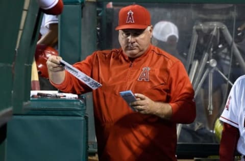 Sep 12, 2016; Anaheim, CA, USA; Los Angeles Angels manager Mike Scioscia (14) in the dugout during the Angels game against the Seattle Mariners at Angel Stadium of Anaheim. Mandatory Credit: Robert Hanashiro-USA TODAY Sports