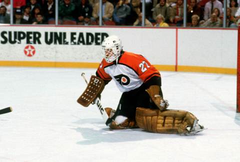 Ron Hextall of the Philadelphia Flyers defends his goal against the Chicago Blackhawks. (Photo by Focus on Sport/Getty Images)