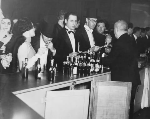 Revellers buying their drinks at a bar in 1931, when Prohibition was in full effect