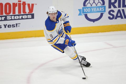 Mar 7, 2021; Uniondale, New York, USA; Buffalo Sabres center Jack Eichel (9) controls the puck against the New York Islanders during the third period at Nassau Veterans Memorial Coliseum. Mandatory Credit: Brad Penner-USA TODAY Sports