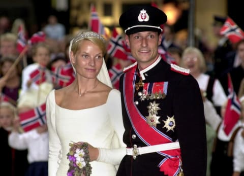 Norwegian Crown Prince Haakon and Mette-Marit Tjessem Hoiby leave the Oslo Cathedral August 25, 2001 after their wedding.