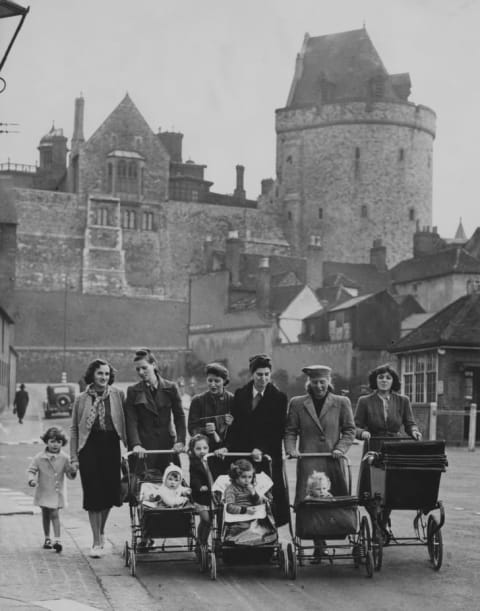 A group of evacuee women and their children with donated prams in Windsor, Berkshire, 5th October 1940. The prams were donated after Queen Elizabeth (later Queen Mother) visited the evacuees and noticed the shortage