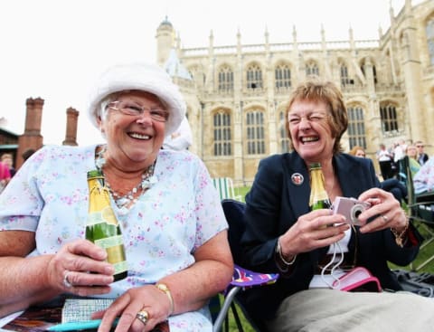 etty Garvey (L) from Manchester and a friend also from Manchester drink champagne as they wait to catch a glimpse of the Royal party in front of St. George's Chapel during Garter Day, the 660th Anniversary Service, on June 16, 2008 in Windsor, England