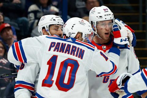 COLUMBUS, OHIO – OCTOBER 14: Will Cuylle #50 of the New York Rangers is congratulated by Vincent Trocheck #16 and Artemi Panarin #10 after scoring his first career NHL goal during the third period of the game against the Columbus Blue Jackets at Nationwide Arena on October 14, 2023, in Columbus, Ohio. Columbus defeated New York 5-3. (Photo by Kirk Irwin/Getty Images)