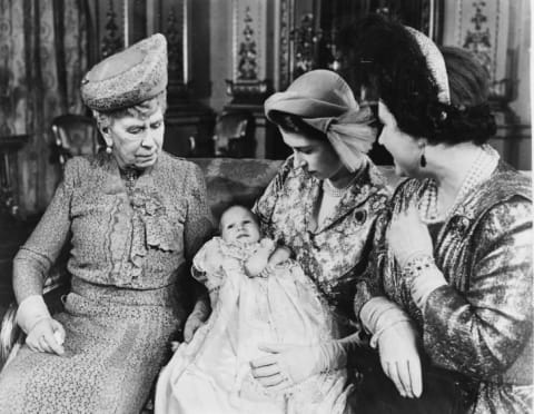 Portrait of then-Princess Elizabeth holding her daughter, Princess Anne, with the grandmothers Queen Mary (left) and Queen Elizabeth, following the christening in October 1950.