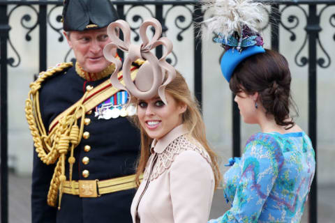 Princess Beatrice of York (L) with her sister Princess Eugenie of York arrive to attend the Royal Wedding of Prince William to Catherine Middleton at Westminster Abbey on April 29, 2011 in London, England