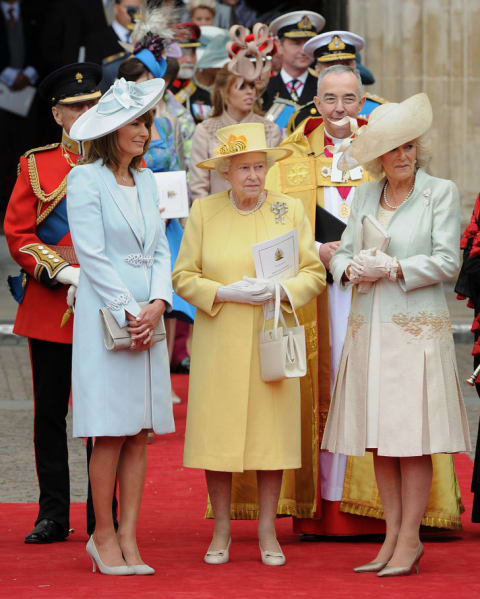 Britain's Queen Elizabeth II (C), Carole Middleton (L) and Camilla, Duchess of Cornwall talk as they come out of Westminster Abbey in London, following the wedding ceremony of Prince William and Kate, Duchess of Cambridge, on April 29, 2011