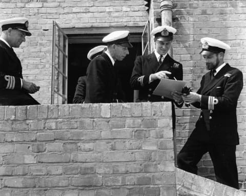 Lieutenant Philip Mountbatten, prior to his marriage to Princess Elizabeth, talking to a group of Naval officers on his return to Royal Navy duties, at the Petty Officers Training Centre in Corsham, Wiltshire, July 31st 1947