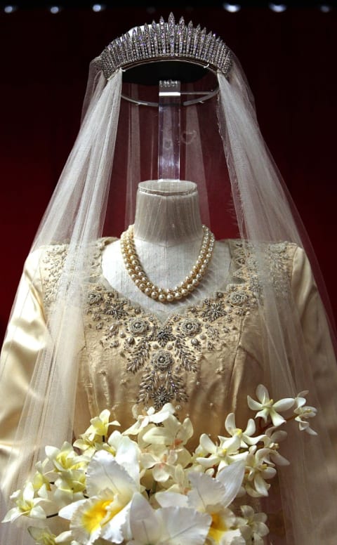 Princess Elizabeth's wedding dress, designed by Norman Hartnell, is displayed at the 'Royal Wedding: 20 Novermber 1957' exhibition at Buckingham Palace on July 27, 2007 in London