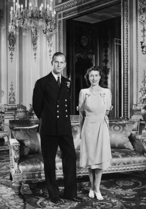 Princess Elizabeth (future Queen Elizabeth II) and her Fiance Philip Mountbatten (also the Duke of Edinburgh) pose in the Buckingham Palace on July 09, 1947 in London, the day their engagement was officially announced.