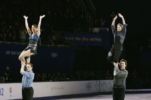 Pairs skaters Jamie Salé and David Pelletier of Canada and Elena Berezhnaya and Anton Sikharulidze of Russia perform in the figure skating exhibition during the Salt Lake City Winter Olympic Games.