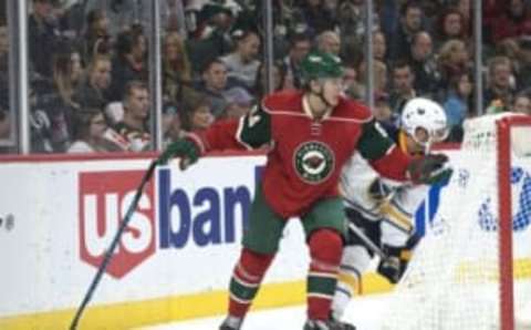 Nov 1, 2016; Saint Paul, MN, USA; Minnesota Wild forward Mikael Granlund (64) reacts to a slash breaking his stick by Buffalo Sabres defenseman Josh Gorges (4) who is penalized during the second period at Xcel Energy Center. Mandatory Credit: Marilyn Indahl-USA TODAY Sports