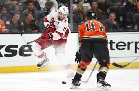 ANAHEIM, CALIFORNIA – OCTOBER 18: Jordan Staal #11 of the Carolina Hurricanes shoots the puck past Hampus Lindholm #47 of the Anaheim Ducks during the second period of a game at Honda Center on October 18, 2019, in Anaheim, California. (Photo by Sean M. Haffey/Getty Images)