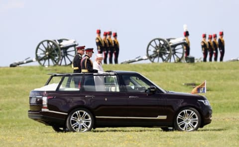 Queen Elizabeth II, Captain-General of the Royal Regiment of Artillery, oversees a Royal Review from an open-top Range Rover on the occasion of their Tercentenary at Knighton Down on May 26, 2016 in Lark Hill, England