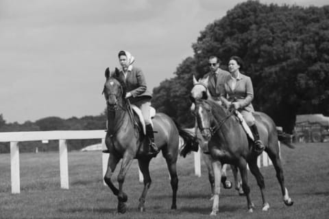 Queen Elizabeth II, Princess Margaret, Countess of Snowdon (1930 - 2002), and Prince Edward, Duke of Kent, riding at Ascot Racecourse, UK, 27th June 1968