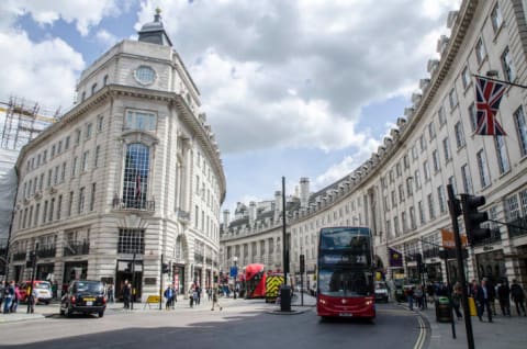 People, cars and double-decker bus passing by London's Regent Street