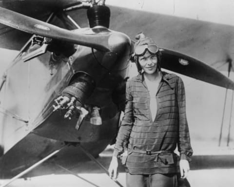 Amelia Earhart in front of her biplane ‘Friendship’ in Newfoundland.