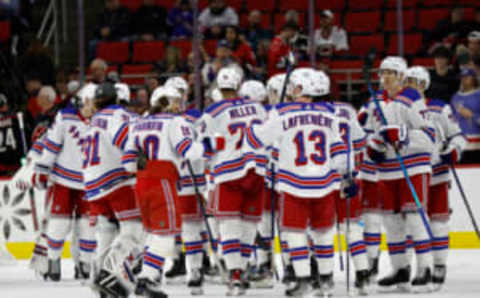 RALEIGH, NORTH CAROLINA – FEBRUARY 11: The New York Rangers celebrate their 6-2 victory over the Carolina Hurricanes following the game at PNC Arena on February 11, 2023, in Raleigh, North Carolina. (Photo by Jared C. Tilton/Getty Images)