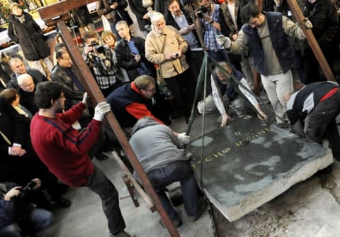 Archeologists lift Tycho Brahe's tombstone in Prague in 2010.