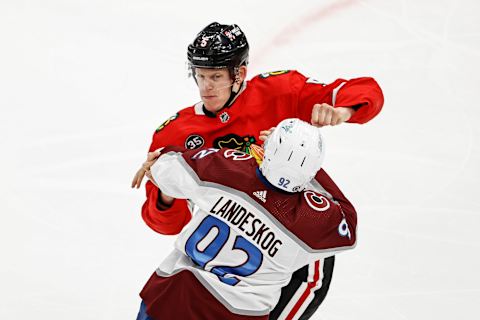 Jan 4, 2022; Chicago, Illinois, USA; Chicago Blackhawks defenseman Connor Murphy (5) fights with Colorado Avalanche left wing Gabriel Landeskog (92) during the first period at United Center. Mandatory Credit: Kamil Krzaczynski-USA TODAY Sports